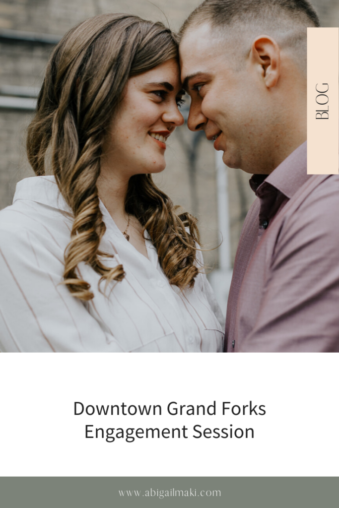Downtown Grand Forks  engagement session by Abigail Maki Photography. Includes posing inspiration for an outdoor couples session and wedding planning tips. Book your couples session and browse the blog for more inspiration #couples #photography #couplesphotography #sanfranciscophotographer